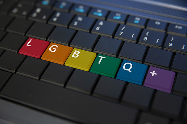 A computer keyboard with no letters apart from LGBTQ+ in rainbow colours.